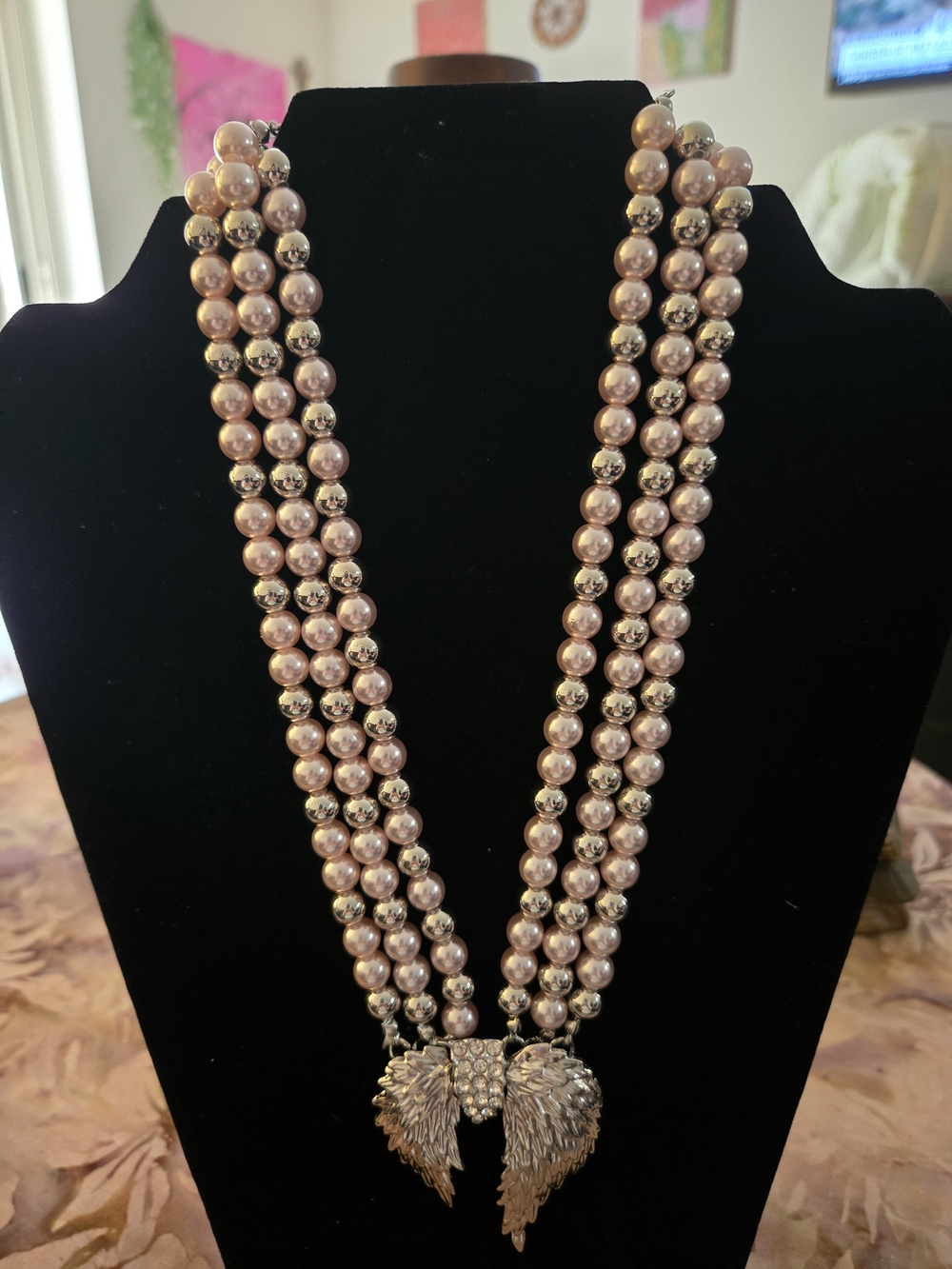 Triple-Strand Pink Pearl Necklace with Silver Wing Pendant